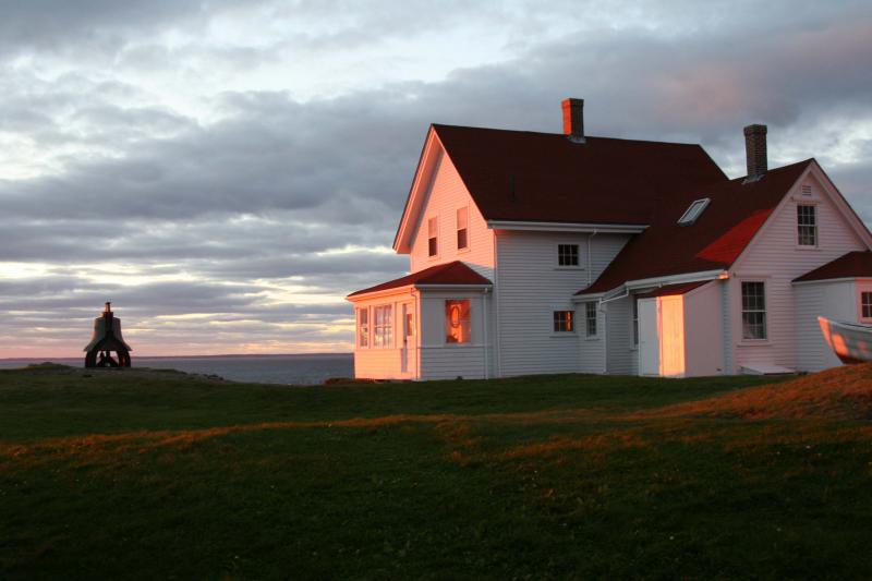 The Monhegan Museum, located on the top of a hill overlooking Monhegan Harbor and Muscongus Bay beyond.